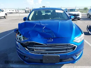 2017 Ford Fusion SE z VIN 3FA6P0H73HR260806, wystawiony jako IAAI lot #42311343 z przebiegiem 143 094 mil mil oraz . Historia ofert i sprzedaży dostępna na DreamBid. Obrazek 12.