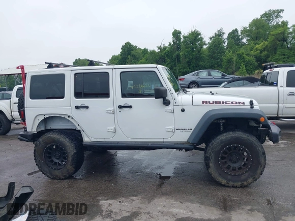 2014 Jeep Wrangler Unlimited Rubicon with VIN 1C4HJWFG4EL104827, listed as a IAAI auction lot 42236622 with 90,935 mi miles and . Bid and sale history available at DreamBid. Image 14.