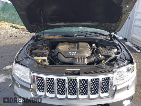 2013 Jeep Grand Cherokee Overland with VIN 1C4RJFCG8DC581719, listed as a IAAI auction lot 41566666 with 152,332 mi miles. Bid and sale history available at carsss.com. Image 10.
