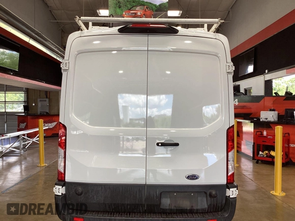 2019 Ford Transit z VIN 1FTYR2CM1KKA32062, wystawiony jako IAAI lot #42596475 z przebiegiem 151 369 mil mil oraz . Historia ofert i sprzedaży dostępna na DreamBid. Obrazek 4.