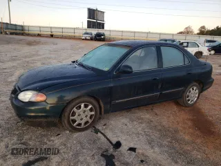 2000 Hyundai Elantra GLS z VIN KMHJF35F6YU890800, wystawiony jako Copart lot #76972294 z przebiegiem 159 134 mil mil oraz Szkoda całkowita • Salvage title. Historia ofert i sprzedaży dostępna na DreamBid. Obrazek 1.