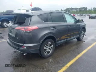2018 Toyota RAV4 XLE with VIN 2T3RFREV5JW701564, listed as a IAAI auction lot 41976067 with 128,404 mi miles. Bid and sale history available at carsss.com. Image 4.