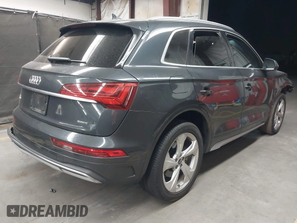 2021 Audi Q5 Premium Plus z VIN WA1BAAFY6M2130300, wystawiony jako IAAI lot #42250661 z przebiegiem 49 147 mil mil oraz . Historia ofert i sprzedaży dostępna na DreamBid. Obrazek 4.