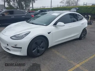 2020 Tesla Model 3 Long Range with VIN 5YJ3E1EB0LF803217, listed as a IAAI auction lot 41871940 with 130,391 mi miles. Bid and sale history available at carsss.com. Image 2.
