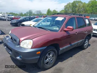 2003 Hyundai Santa Fe GLS z VIN KM8SC73D83U543841, wystawiony jako IAAI lot #42220132 z przebiegiem 215 325 mil mil oraz . Historia ofert i sprzedaży dostępna na DreamBid. Obrazek 2.