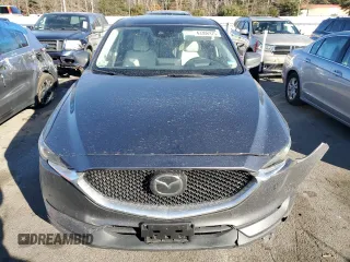 2021 Mazda CX-5 Grand Touring with VIN JM3KFBDM9M0490239, listed as a Copart auction lot 43306975 with 47,010 mi miles and Salvage Title. Bid and sale history available at carsss.com. Image 5.