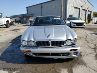 2000 Jaguar XJ with VIN SAJDA14C9YLF17465, listed as a Copart auction lot 75537214 with 115,918 mi miles and Salvage Title. Bid and sale history available at carsss.com. Image 5.