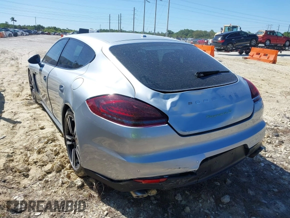 2014 Porsche Panamera S E-Hybrid with VIN WP0AD2A75EL044663, listed as a IAAI auction lot 41818381 with 44,194 mi miles and . Bid and sale history available at DreamBid. Image 6.