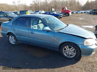 2000 Honda Civic EX with VIN 1HGEJ8649YL047194, listed as a IAAI auction lot 41526765 with 127,697 mi miles. Bid and sale history available at carsss.com. Image 13.