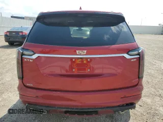 2024 Cadillac XT6 AWD Sport z VIN 1GYKPHRS0RZ724524, wystawiony jako Copart lot #61333185 z przebiegiem 12 799 mil mil oraz Nie do naprawy • Non repairable. Historia ofert i sprzedaży dostępna na DreamBid. Obrazek 6.