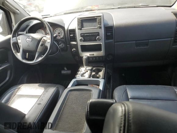 2015 Nissan Titan Pro-4X with VIN 1N6BA0EC1FN507894, listed as a Copart auction lot 65784274 with 147,576 mi miles and Salvage title. Bid and sale history available at DreamBid. Image 8.