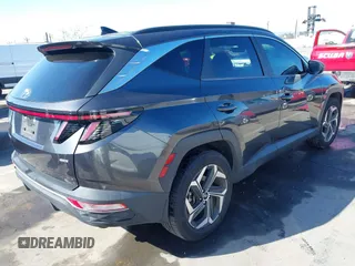 2022 Hyundai Tucson SEL with VIN 5NMJCCAEXNH061242, listed as a IAAI auction lot 41866145 with 63,501 mi miles and . Bid and sale history available at carsss.com. Image 4.