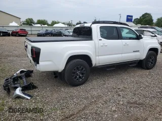 2023 Toyota Tacoma SR with VIN 3TMCZ5AN2PM642205, listed as a Copart auction lot 61045955 with 10,596 mi miles and Salvage title. Bid and sale history available at DreamBid. Image 3.