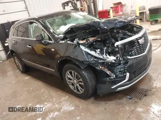 2021 Cadillac XT5 AWD Premium Luxury with VIN 1GYKNDR41MZ156521, listed as a IAAI auction lot 41554791 with 30,871 mi miles. Bid and sale history available at carsss.com. Image 1.