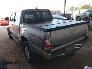 2014 Toyota Tacoma with VIN 3TMLU4EN3EM162738, listed as a IAAI auction lot 41871226 with 135,318 mi miles and . Bid and sale history available at DreamBid. Image 3.
