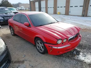 2002 Jaguar X-Type with VIN SAJEA51C22WC54063, listed as a IAAI auction lot 41404835 with 125,533 mi miles. Bid and sale history available at carsss.com. Image 1.
