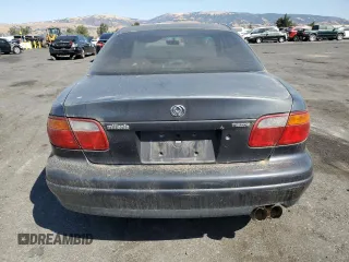 1997 Mazda Millenia z VIN JM1TA2213V1308406, wystawiony jako Copart lot #74141674 z przebiegiem 205 115 mil mil oraz Tytuł czysty. Historia ofert i sprzedaży dostępna na DreamBid. Obrazek 6.