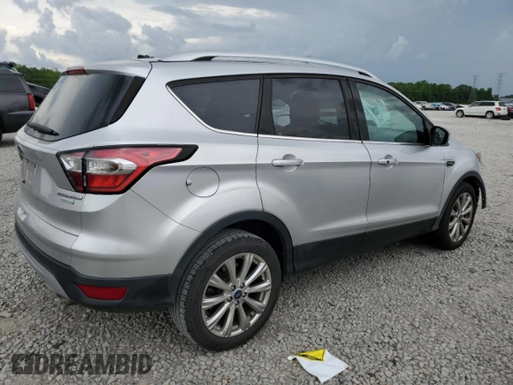 2017 Ford Escape Titanium with VIN 1FMCU0J96HUC12822, listed as a Copart auction lot 54259375 with 127,114 mi miles and Salvage Title. Bid and sale history available at DreamBid. Image 3.