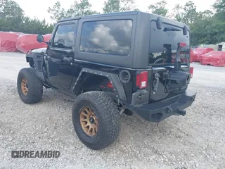 2012 Jeep Wrangler Sport z VIN 1C4AJWAG2CL286680, wystawiony jako IAAI lot #42434411 z przebiegiem 97 142 mil mil oraz . Historia ofert i sprzedaży dostępna na DreamBid. Obrazek 3.