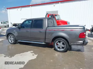 2002 Ford F-150 Harley Davidson with VIN 1FTRW07392KE11409, listed as a IAAI auction lot 41877998 with 148,476 mi miles. Bid and sale history available at carsss.com. Image 14.