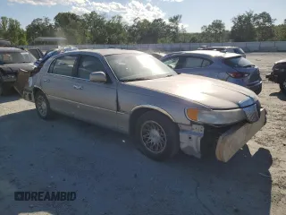 1999 Lincoln Town Car Signature z VIN 1LNHM82W7XY626305, wystawiony jako Copart lot #58009475 z przebiegiem Nie podano mil oraz Szkoda całkowita • Salvage title. Historia ofert i sprzedaży dostępna na DreamBid. Obrazek 4.