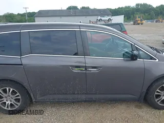2012 Honda Odyssey EX-L with VIN 5FNRL5H60CB054277, listed as a IAAI auction lot 42459861 with 205,722 mi miles and . Bid and sale history available at DreamBid. Image 13.