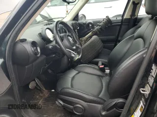 2014 MINI Countryman S with VIN WMWZC5C58EWP39797, listed as a Copart auction lot 62193515 with 84,989 mi miles and Salvage title. Bid and sale history available at DreamBid. Image 7.