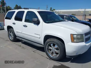 2007 Chevrolet Tahoe LS z VIN 1GNFC13C97R263274, wystawiony jako IAAI lot #42357000 z przebiegiem 231 145 mil mil oraz . Historia ofert i sprzedaży dostępna na DreamBid. Obrazek 1.