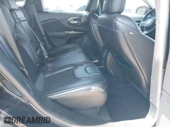 2019 Jeep Cherokee Trailhawk Elite with VIN 1C4PJMBX0KD198328, listed as a IAAI auction lot 42085194 with 76,312 mi miles and . Bid and sale history available at DreamBid. Image 8.