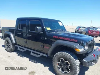 2023 Jeep Gladiator Rubicon z VIN 1C6JJTBG3PL531982, wystawiony jako IAAI lot #42211139 z przebiegiem 28 301 mil mil oraz . Historia ofert i sprzedaży dostępna na DreamBid. Obrazek 1.