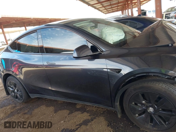 2024 Tesla Model Y with VIN 7SAYGDED9RF053203, listed as a IAAI auction lot 41906729 with Not Provided miles and . Bid and sale history available at DreamBid. Image 13.