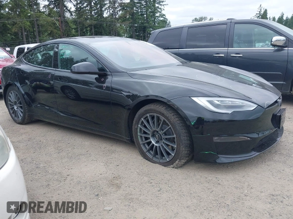 2021 Tesla Model S Plaid with VIN 5YJSA1E62MF447509, listed as a IAAI auction lot 42509281 with 32,372 mi miles and . Bid and sale history available at DreamBid. Image 1.