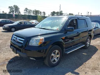 2007 Honda Pilot EX-L with VIN 2HKYF18537H502361, listed as a IAAI auction lot 42039836 with 167,431 mi miles. Bid and sale history available at carsss.com. Image 2.