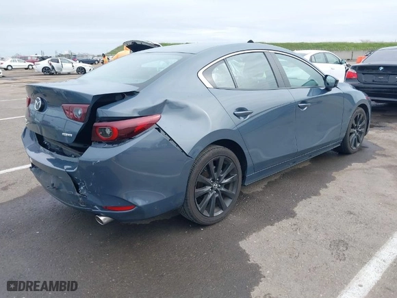 2023 Mazda Mazda3 Sedan 2.5 S Carbon Edition with VIN 3MZBPBCM4PM358964, listed as a IAAI auction lot 41718813 with 34,215 mi miles. Bid and sale history available at carsss.com. Image 4.