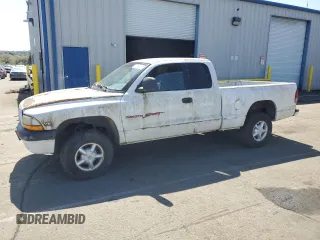 1999 Dodge Dakota SLT z VIN 1B7GG22X5XS125249, wystawiony jako Copart lot #51854885 z przebiegiem 169 018 mil mil oraz Czysty tytuł • Clean title. Historia ofert i sprzedaży dostępna na DreamBid. Obrazek 1.