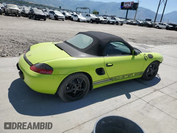 1999 Porsche Boxster with VIN WP0CA2987XU622760, listed as a Copart auction lot 59898355 with 104,425 mi miles and Salvage title. Bid and sale history available at DreamBid. Image 3.