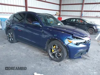 2019 Alfa Romeo Stelvio Ti Sport z VIN ZASPAKBN8K7C40012, wystawiony jako IAAI lot #40988722 z przebiegiem 118 597 mil mil oraz . Historia ofert i sprzedaży dostępna na DreamBid. Obrazek 1.