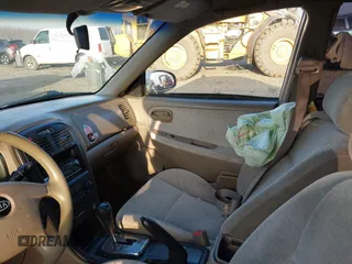2004 Kia Optima LX z VIN KNAGD126045302372, wystawiony jako IAAI lot #41022315 z przebiegiem 199 588 mil mil oraz . Historia ofert i sprzedaży dostępna na DreamBid. Obrazek 5.