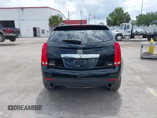 2015 Cadillac SRX Performance Collection z VIN 3GYFNCE31FS597798, wystawiony jako IAAI lot #42387793 z przebiegiem 159 986 mil mil oraz . Historia ofert i sprzedaży dostępna na DreamBid. Obrazek 16.