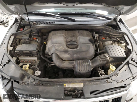 2011 Jeep Grand Cherokee Laredo z VIN 1J4RR4GGXBC609891, wystawiony jako Copart lot #52089645 z przebiegiem 180 895 mil mil oraz Szkoda całkowita • Salvage title. Historia ofert i sprzedaży dostępna na DreamBid. Obrazek 14.