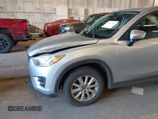 2016 Mazda CX-5 Sport with VIN JM3KE2BE5G0720507, listed as a IAAI auction lot 41872003 with 160,727 mi miles and . Bid and sale history available at carsss.com. Image 6.