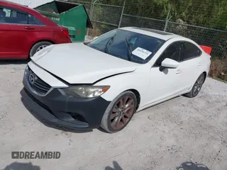 2015 Mazda 6 i Grand Touring with VIN JM1GJ1W50F1204322, listed as a IAAI auction lot 40694216 with 141,357 mi miles. Bid and sale history available at carsss.com. Image 2.