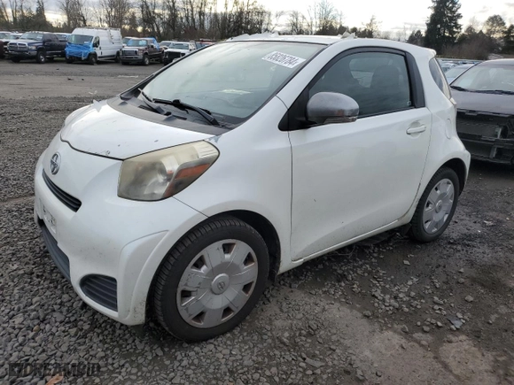 2012 Scion iQ with VIN JTNJJXB0XCJ018779, listed as a Copart auction lot 85826784 with 49,057 mi miles and Clean Title. Bid and sale history available at carsss.com. Image 1.