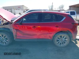 2020 Mazda CX-5 Grand Touring with VIN JM3KFADM3L0761286, listed as a IAAI auction lot 41715379 with 145,656 mi miles and . Bid and sale history available at DreamBid. Image 15.