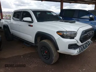 2019 Toyota Tacoma SR with VIN 5TFCZ5AN2KX208241, listed as a IAAI auction lot 41794005 with 82,260 mi miles and . Bid and sale history available at DreamBid. Image 1.