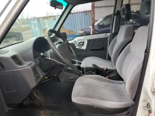 1996 Suzuki Sidekick JX z VIN 2S3TD03V7T6409487, wystawiony jako Copart lot #49977795 z przebiegiem 137 011 mil mil oraz Szkoda całkowita • Salvage title. Historia ofert i sprzedaży dostępna na DreamBid. Obrazek 7.