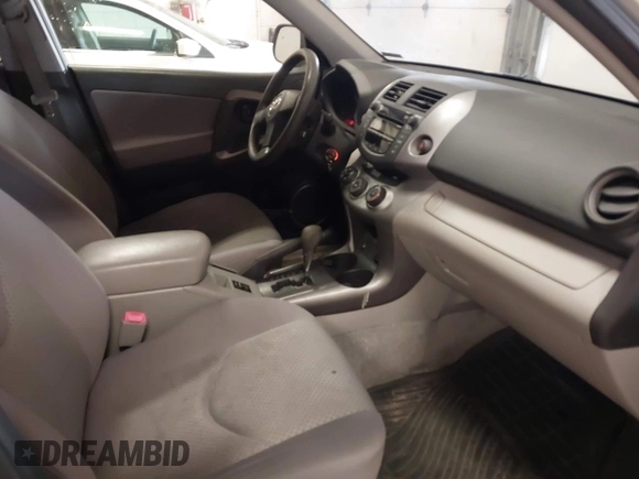 2007 Toyota RAV4 with VIN JTMBK33V776014769, listed as a IAAI auction lot 42024759 with 216,657 mi miles. Bid and sale history available at carsss.com. Image 5.
