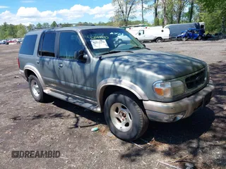 1999 Ford Explorer XLT z VIN 1FMDU34E2XUA07544, wystawiony jako IAAI lot #42211210 z przebiegiem 156 786 mil mil oraz . Historia ofert i sprzedaży dostępna na DreamBid. Obrazek 1.