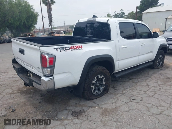 2023 Toyota Tacoma SR with VIN 3TMCZ5AN1PM556299, listed as a IAAI auction lot 42344160 with 42,338 mi miles and . Bid and sale history available at DreamBid. Image 4.