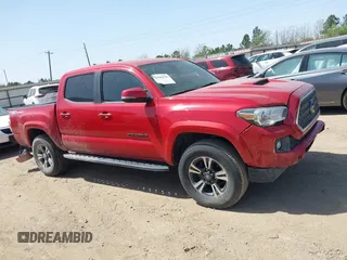 2018 Toyota Tacoma SR5 with VIN 5TFAZ5CN0JX063350, listed as a IAAI auction lot 41829396 with 61,155 mi miles and . Bid and sale history available at DreamBid. Image 14.
